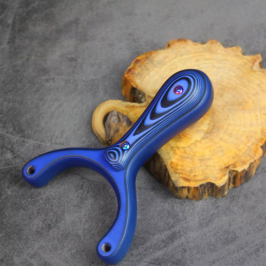 X31 slingshot with comfortable hand-polished grip and balanced design for accurate and fatigue-free shooting control.