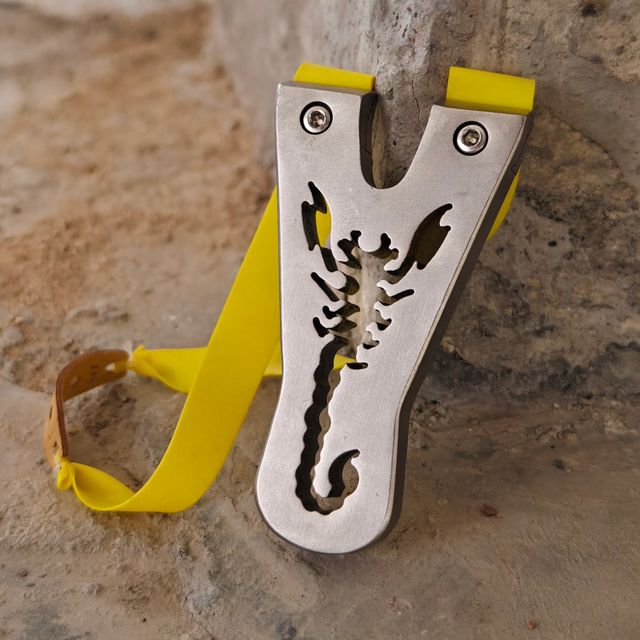 High-performance stainless steel slingshot with sharp, angular design.