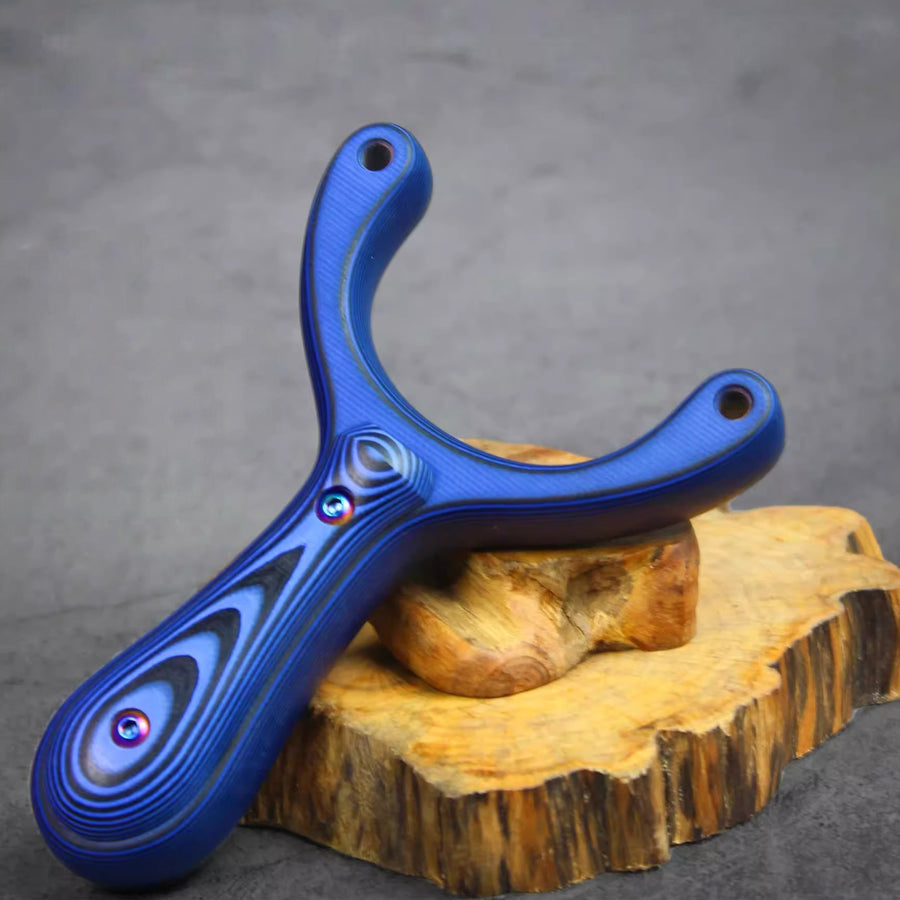 X31 slingshot with 5.0–6.5mm gradient tapered holes supporting secure 5.5mm ball-locking systems for precision shooting