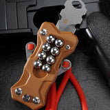 Compact carry TitanShot-X24 stainless steel slingshot ideal for camping, backpacking, and outdoor survival gear setups.