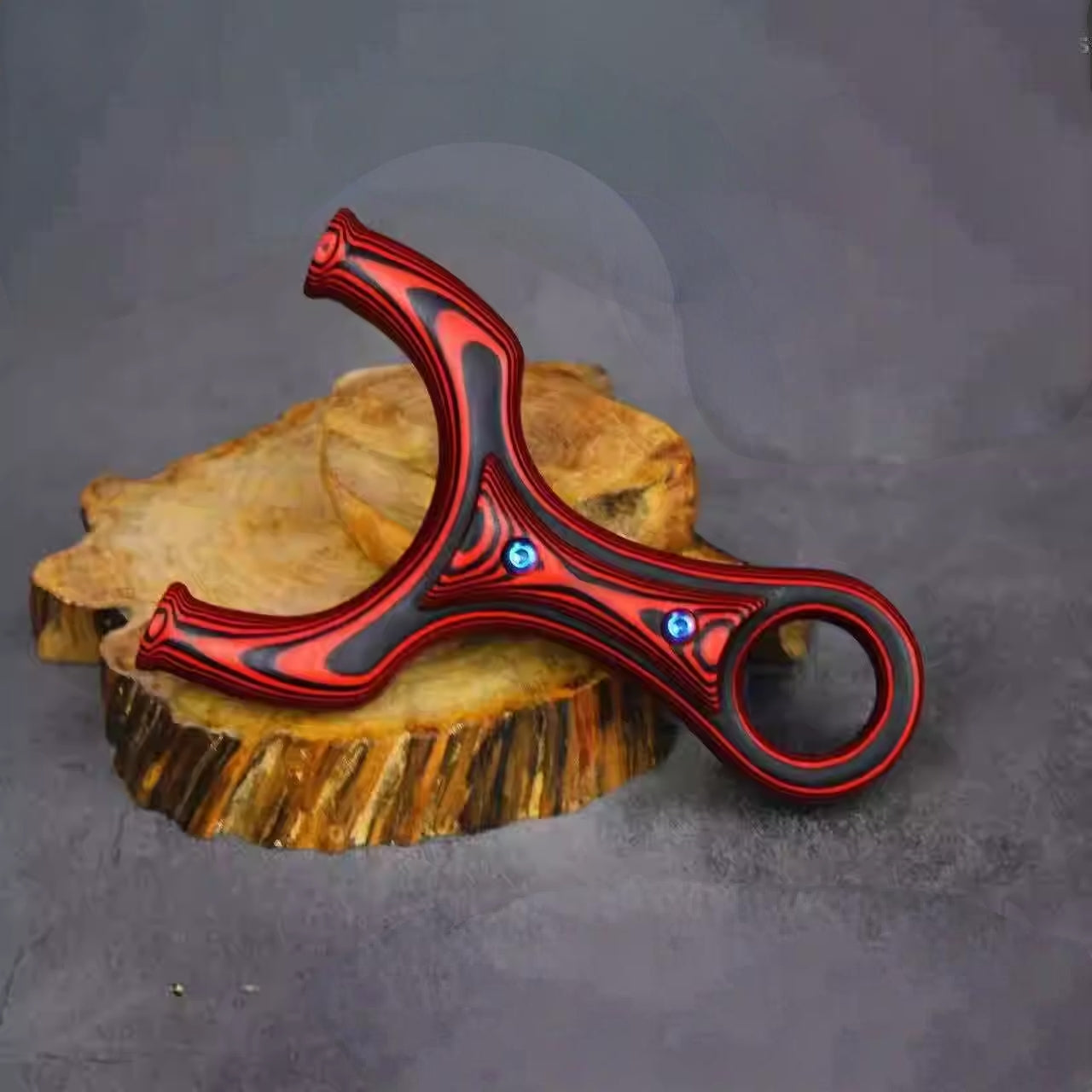 Durable SkyTiger-X26 outdoor slingshot with ergonomic grip and water-resistant G10 construction for all-weather performance.