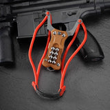 Triple-function TitanShot-X24 outdoor survival tool combining slingshot power, sharp folding knife, and glass breaker tip in one.