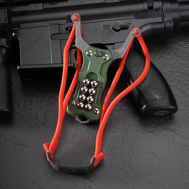 Compact tactical TitanShot-X24 multi-tool slingshot with knife and glass breaker, optimized for emergency and self-defense use.