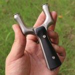 Ergonomic Predator-X28 precision slingshot with curved grip design for comfort and stability during extended target shooting.