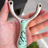 Precision Ice Crack X17 slingshot with balanced grip for accurate shots.