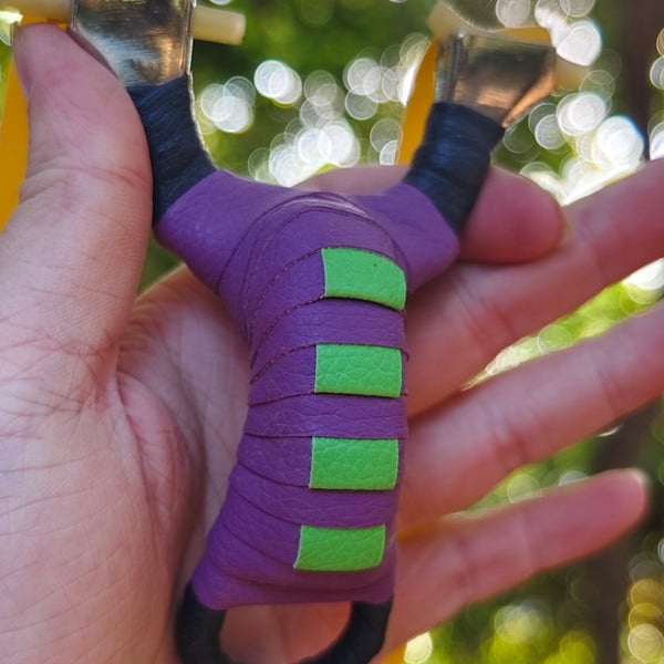 Pocket Snipe X13 compact stainless steel slingshot with purple and black finish for precise, accurate shooting.