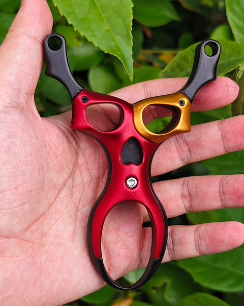 Space Ranger titanium-magnesium alloy slingshot with futuristic alien-inspired design and lightweight strength.