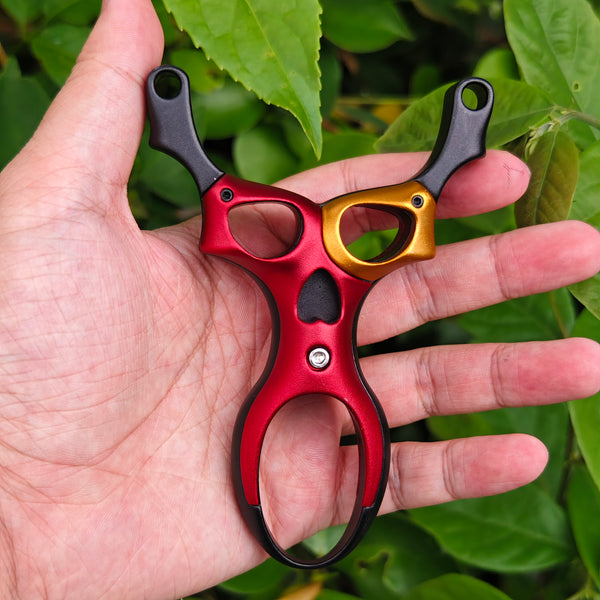 Space Ranger titanium-magnesium alloy slingshot with futuristic alien-inspired design and lightweight strength.