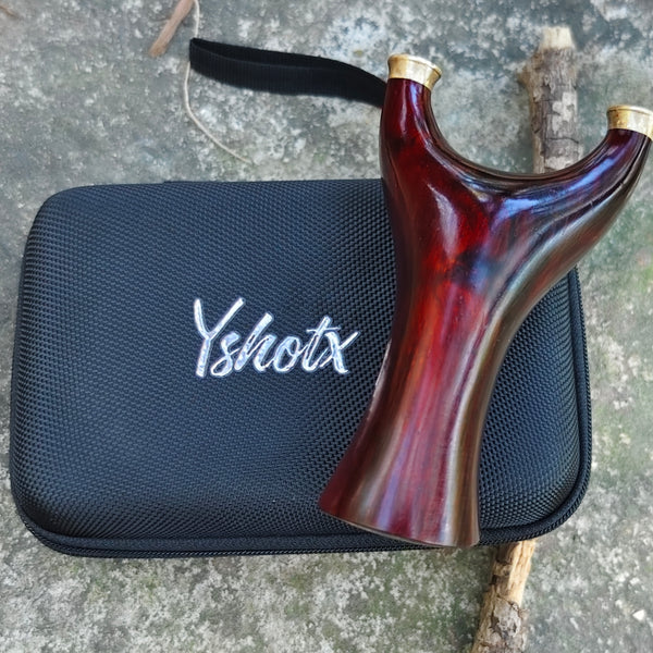 Sylvan Defender X10 rosewood slingshot with natural grain patterns, ergonomic polished grip, and balanced design for stable, accurate, and stylish shooting performance.