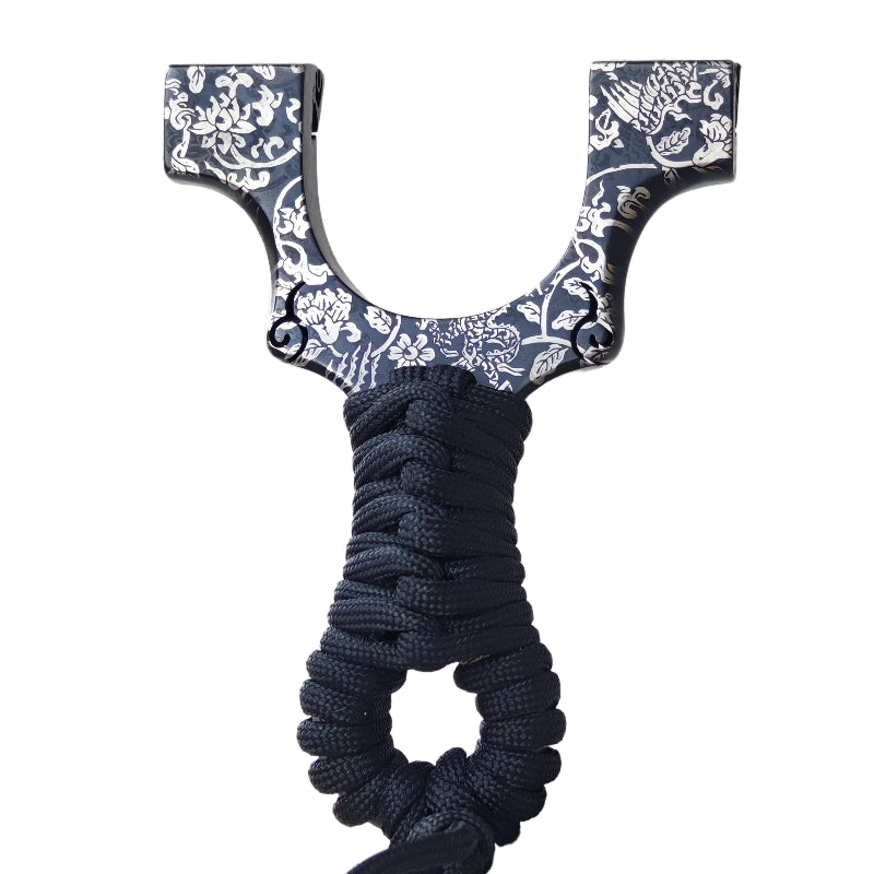 Z09-Shadow Samurai titanium slingshot with handcrafted dark gold finish for precision shooting.