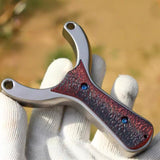 Slingshot with open sight window and wide fork spacing for improved aiming, favored by precision shooters and competitors.